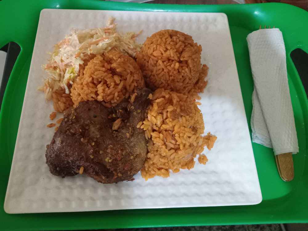 Rice and quater part of peppered chicken and salad image - Mobi Foods